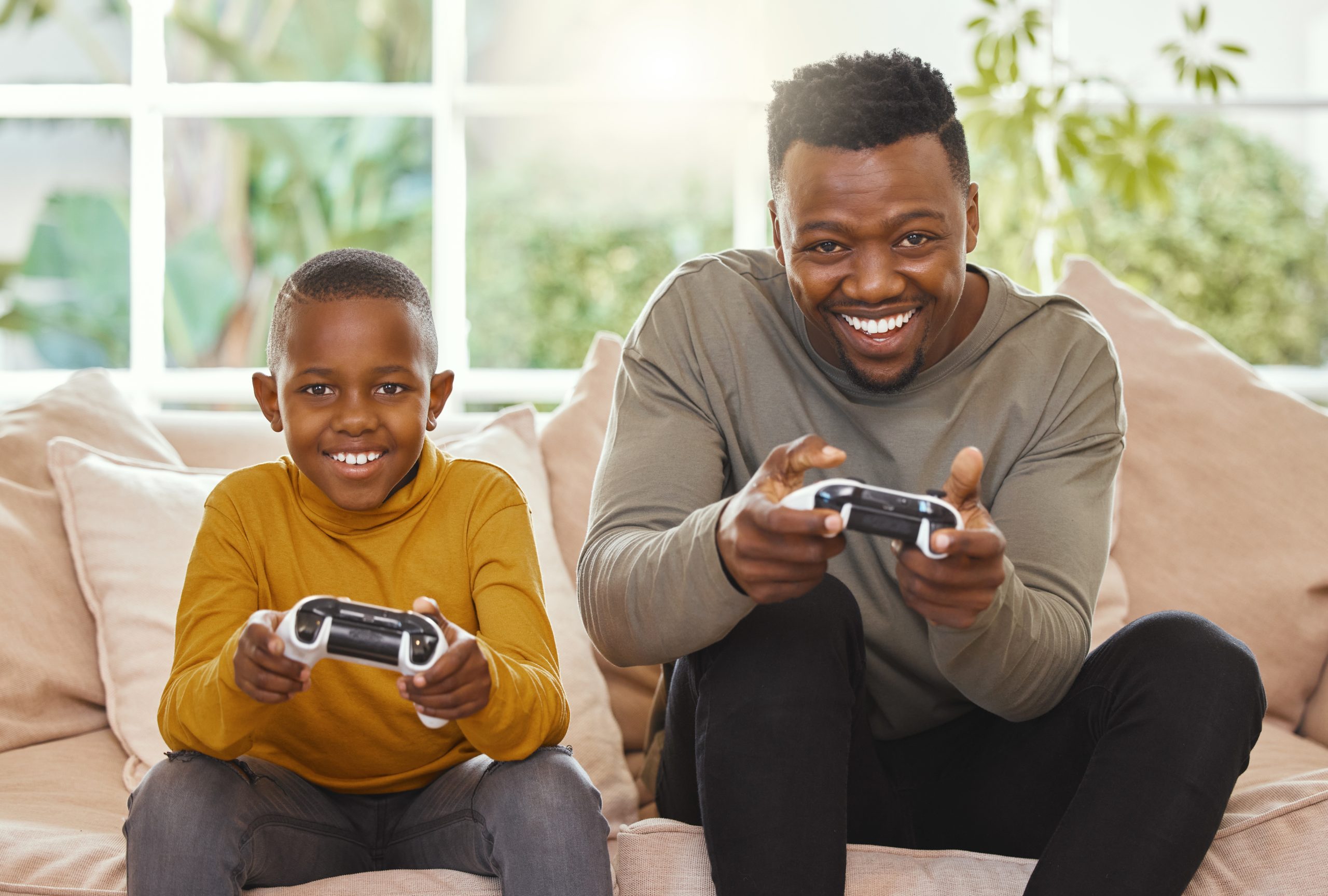 Im going to kick your butt. Shot of a father and son gaming toge